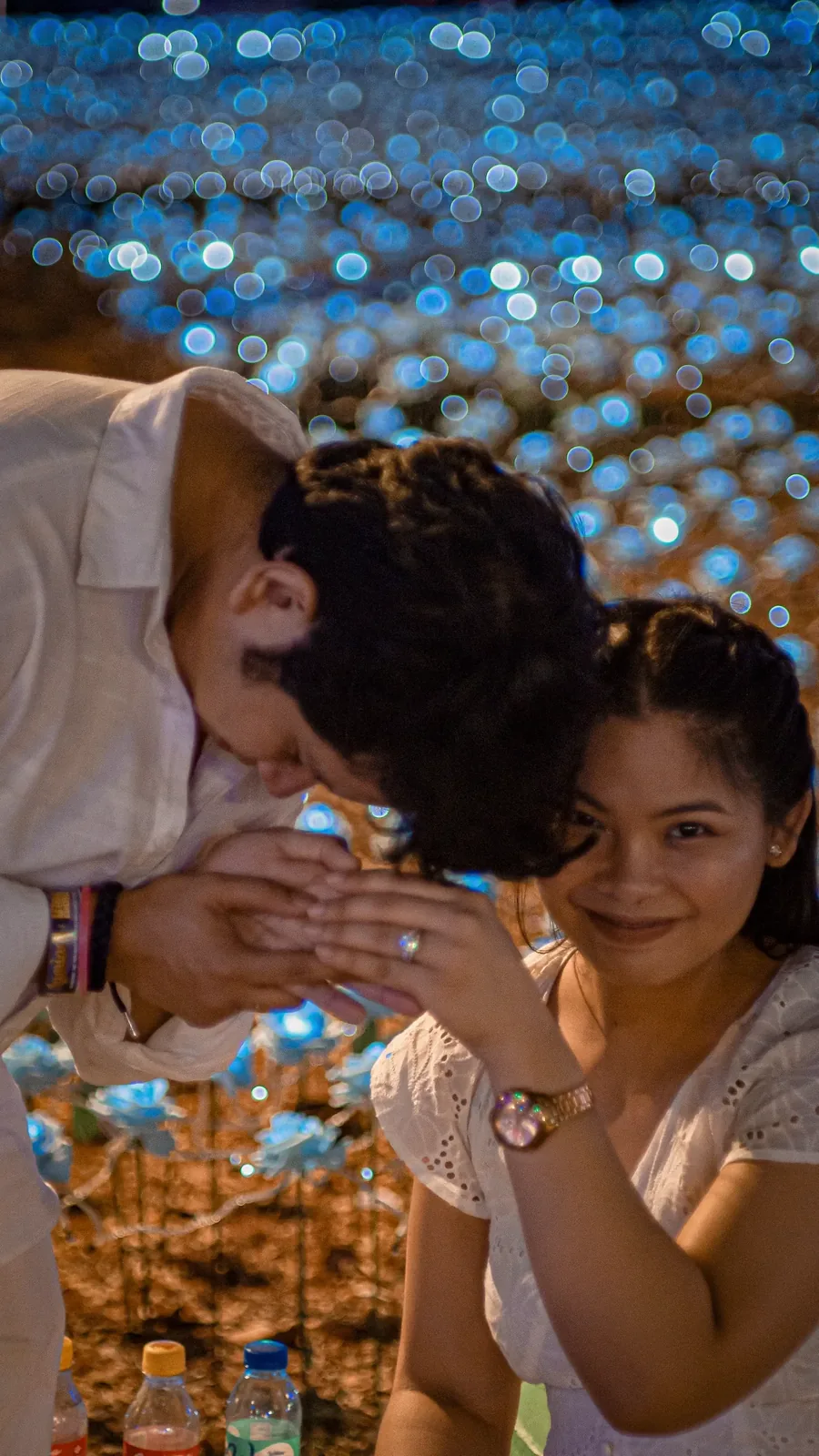 Tommy kissing Jeyan's hand, her ring catching the light